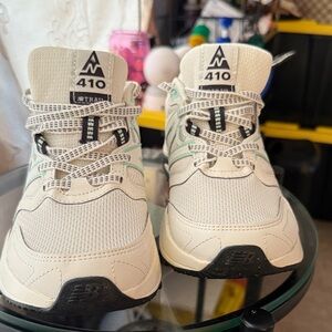 New Balance Beige and Black Sneakers